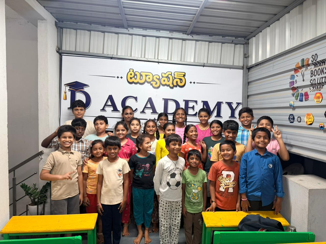 D Academy students and teachers together in front of the academy signboard