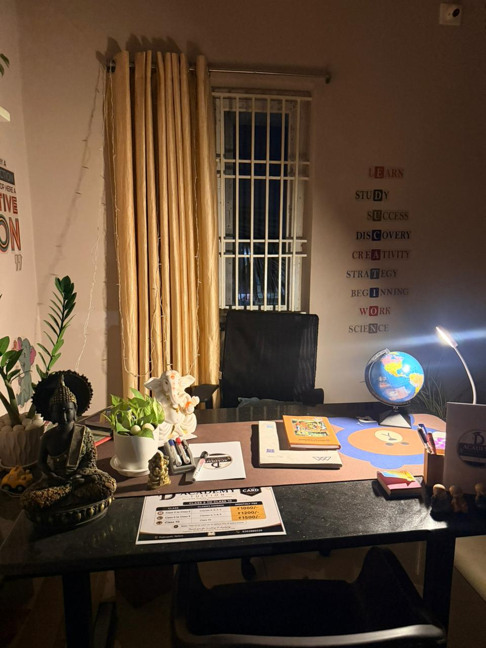 The D Academy study desk with globe, books and learning wall words